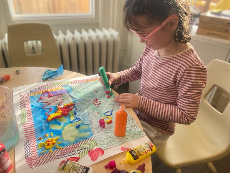student creating art work at aras