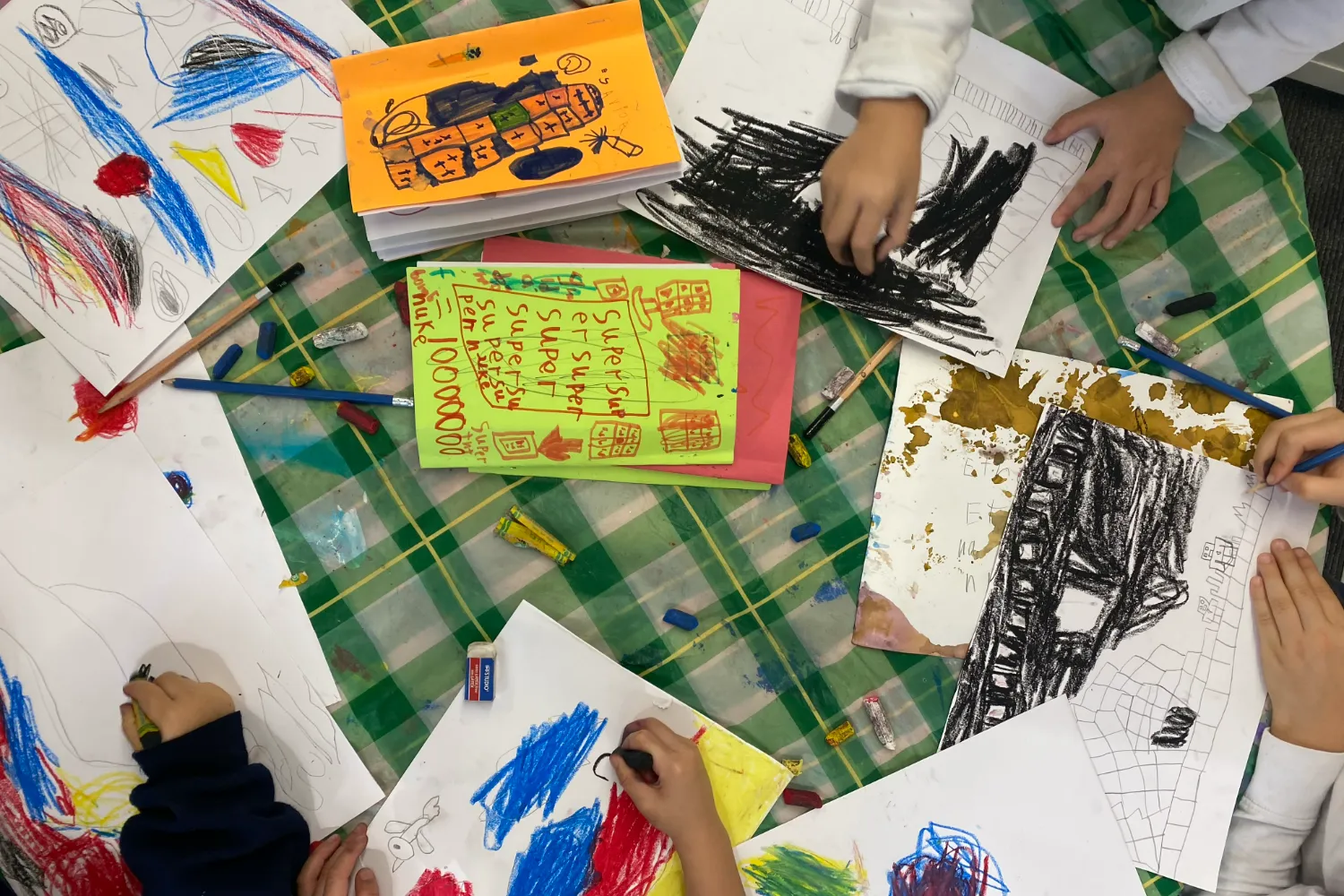 Family Studio Art supplies and colorful sketches from a Family Studio workshop in Toronto.