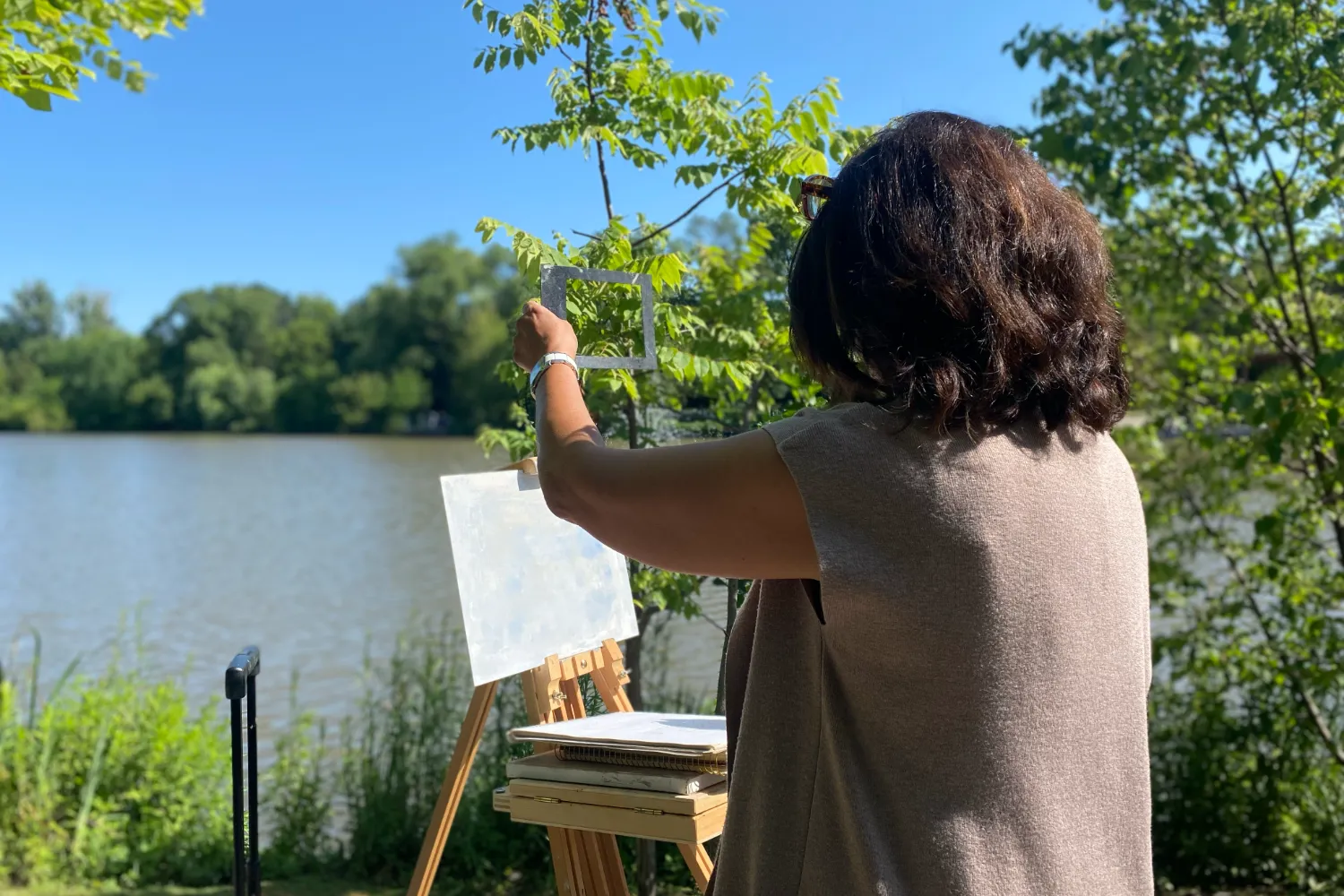 Plein Air in Bloom Spring Florals and Lakeside Light Artist painting outdoors on an easel during a Toronto plein air landscape class.