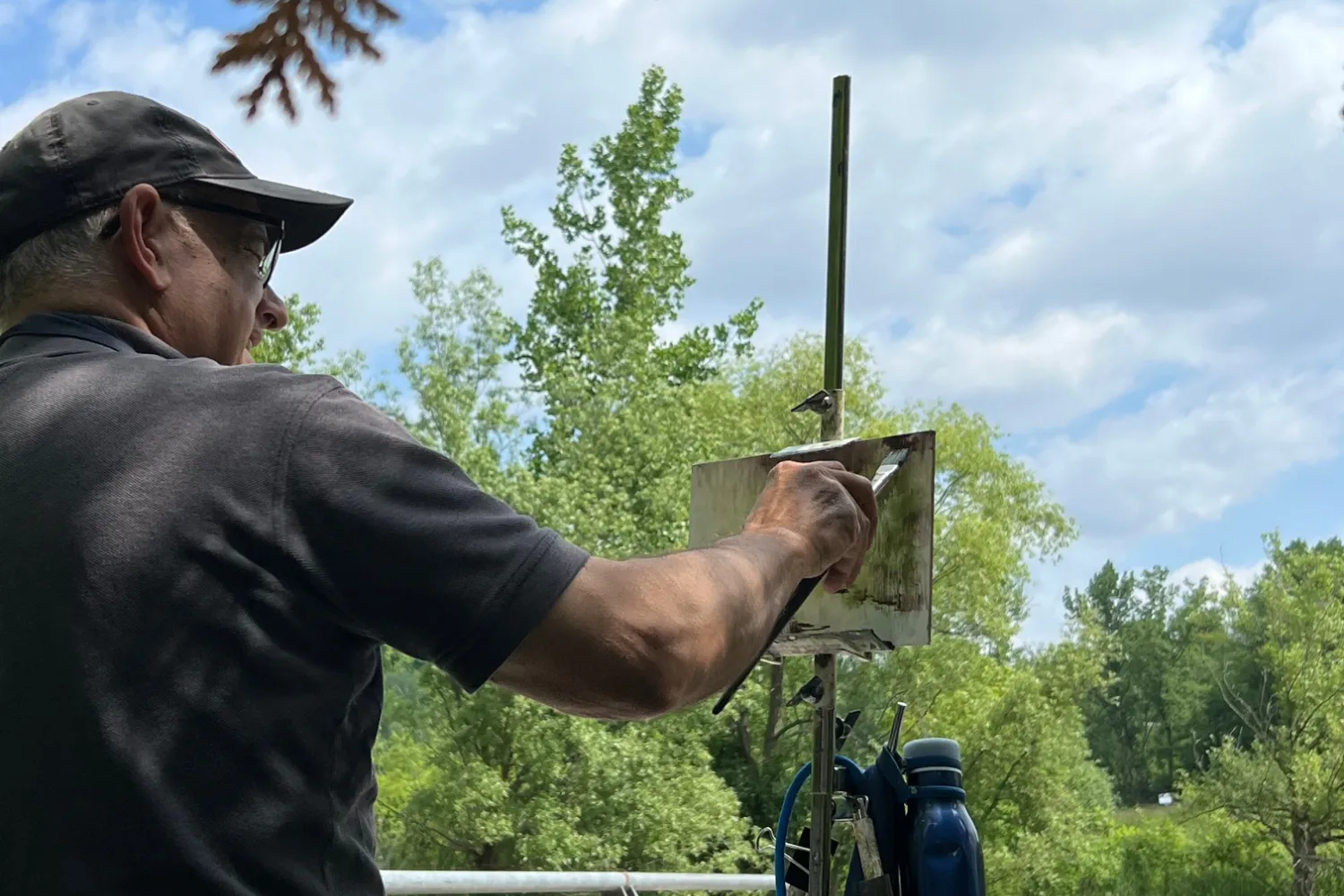 Plein Air in the Gardens The Botanical Landscape Spring 2026 student painting a river landscape during an outdoor plein air session.
