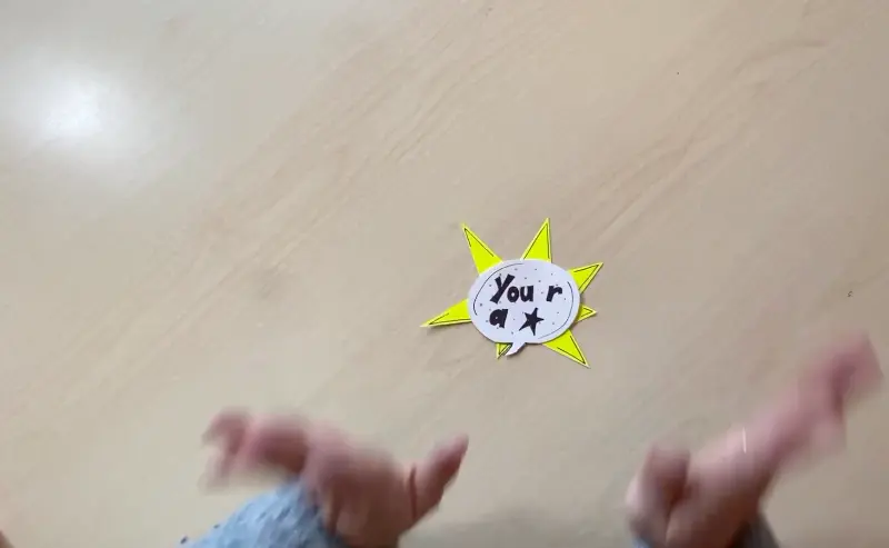 Finished speech bubble glued and centered onto the yellow explosion star